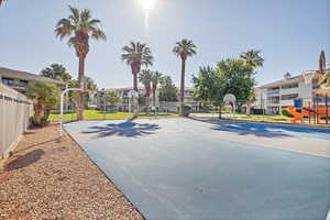 View of sport court with community basketball court and a residential view