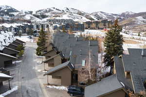 Snowy aerial view featuring a mountain view