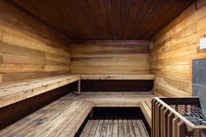 Relaxing sauna / steam room with wood ceiling and wood walls