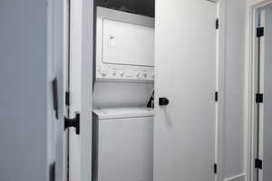 Laundry area featuring stacked washer and dryer