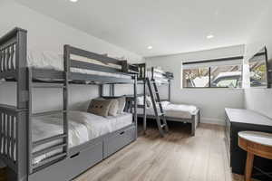 Bedroom featuring light wood-type flooring and recessed lighting