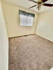 Unfurnished room with carpet and ceiling fan