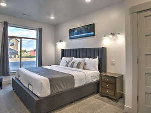 Carpeted bedroom featuring recessed lighting