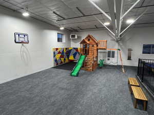 View of playground with a patio area