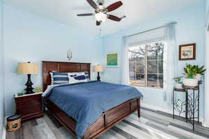 Bedroom 4 featuring wood finished floors and ceiling fan