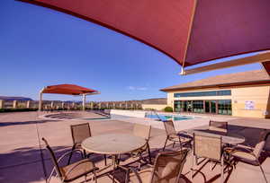 Community pool featuring a patio