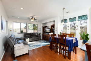 Dining space and family room space featuring engineered hardwood floors, recessed lighting, and a ceiling fan
