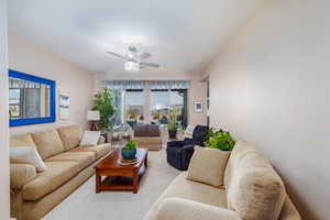 Living room featuring a ceiling fan