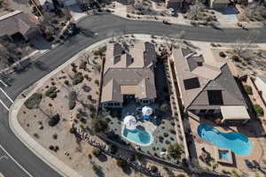 Aerial perspective of suburban area with a pool area
