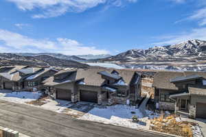 View of mountain background featuring nearby suburban area