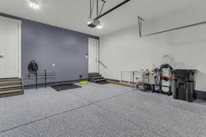 Garage featuring a garage door opener