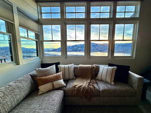 Sunroom with a mountain view and healthy amount of natural light
