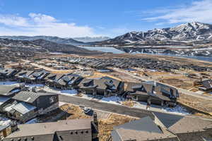 Aerial perspective of suburban area featuring a water and mountain view
