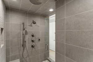 Bathroom featuring a stall shower and recessed lighting