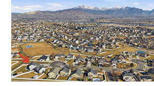 Aerial perspective of suburban area with a mountainous background