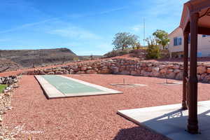 View of home's community featuring shuffleboard
