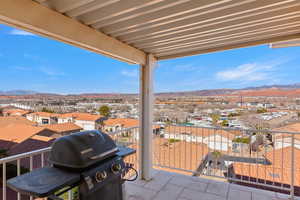 Patio / terrace featuring a mountain view, grilling area, and a residential view