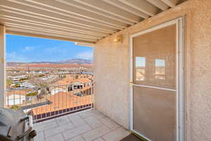 Balcony with a mountain view and a residential view