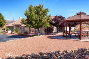 View of property's community with a gazebo and a patio area