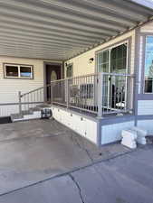Property entrance with a patio