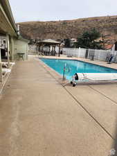 Community pool with a patio and a gazebo