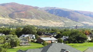 View of mountain backdrop with nearby suburban area