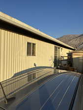 View of side of property with a mountain view