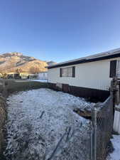 View of snow covered exterior with a mountain view