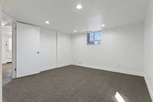 Basement featuring carpet and recessed lighting
