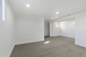 Basement featuring carpet and recessed lighting