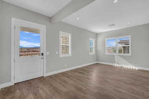 Foyer entrance featuring wood finished floors and recessed lighting