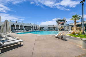 Community pool with a patio area