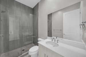 Bathroom with vanity and a shower stall