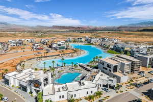 Aerial view of a pool area and a mountainous background