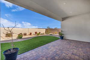 Fenced backyard featuring a patio