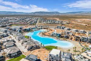 Aerial perspective of suburban area with a mountain backdrop