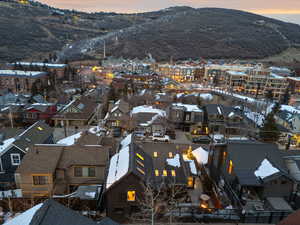 Snowy aerial view featuring a mountain view