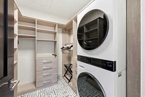 Laundry area featuring stacked washer / dryer
