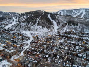Snowy aerial view featuring a mountain view