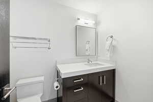 Bathroom featuring vanity and toilet