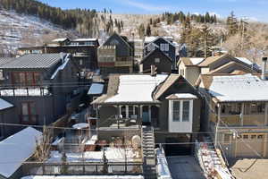 Snowy aerial view with a residential view