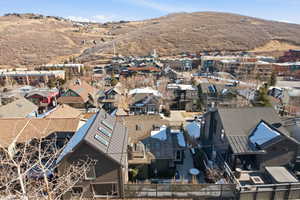 Aerial view of residential area featuring a mountainous background