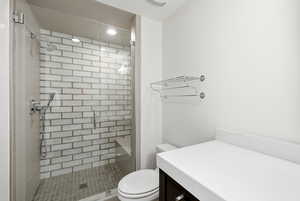 Bathroom featuring vanity and a stall shower