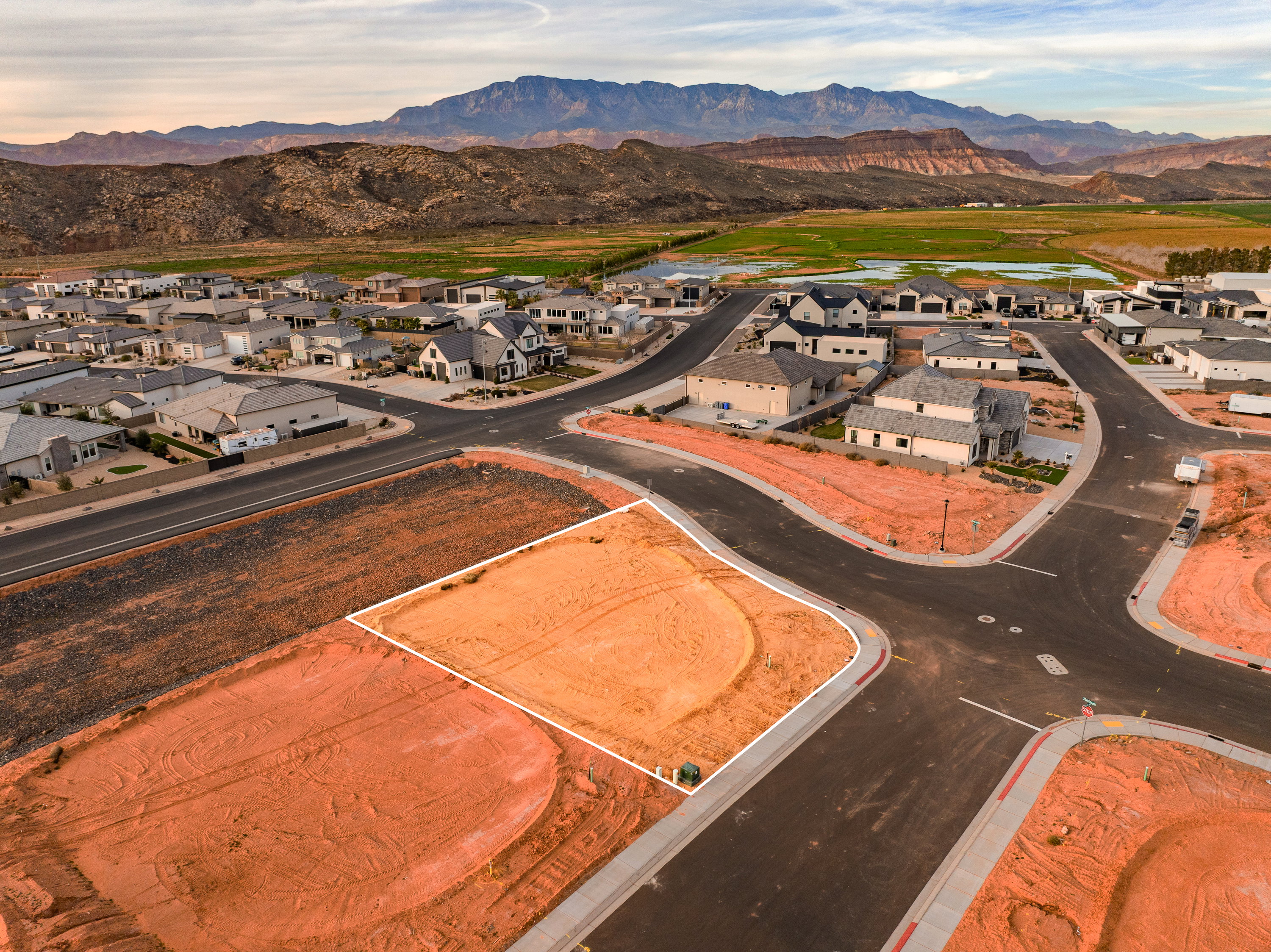 Aerial perspective of suburban area with a mountain backdrop