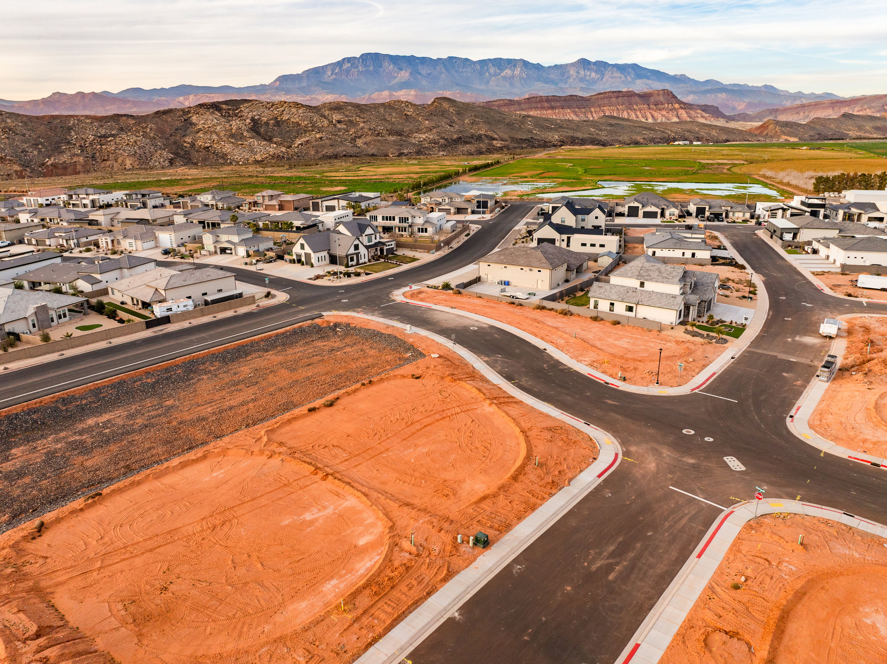 Aerial perspective of suburban area with a mountain backdrop