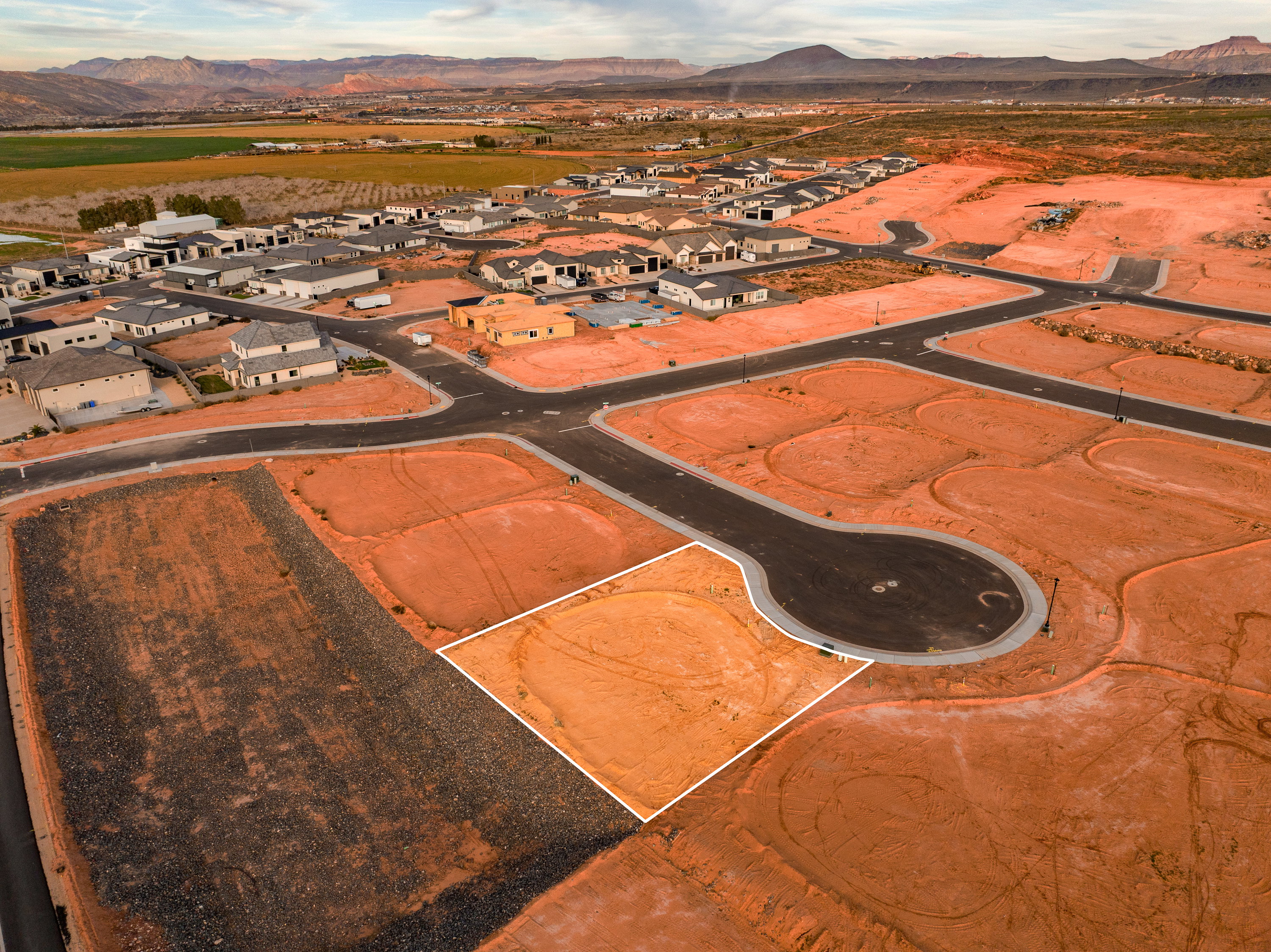 Aerial perspective of suburban area featuring a mountainous background
