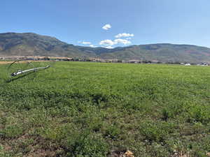 View of mountain backdrop with rural landscape