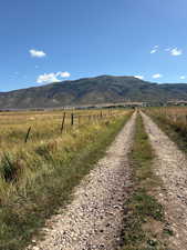 View of mountain backdrop featuring rural landscape