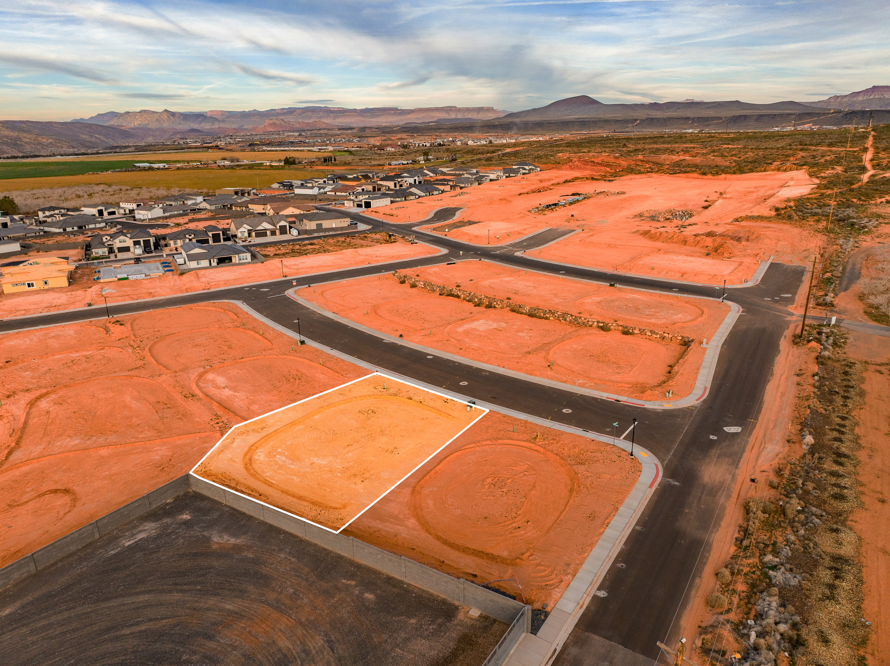 Aerial perspective of suburban area featuring a mountain backdrop