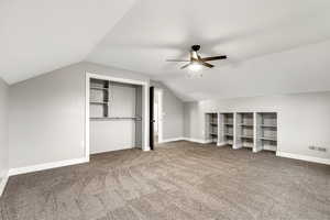 Unfurnished bedroom featuring light colored carpet, ceiling fan, and a closet